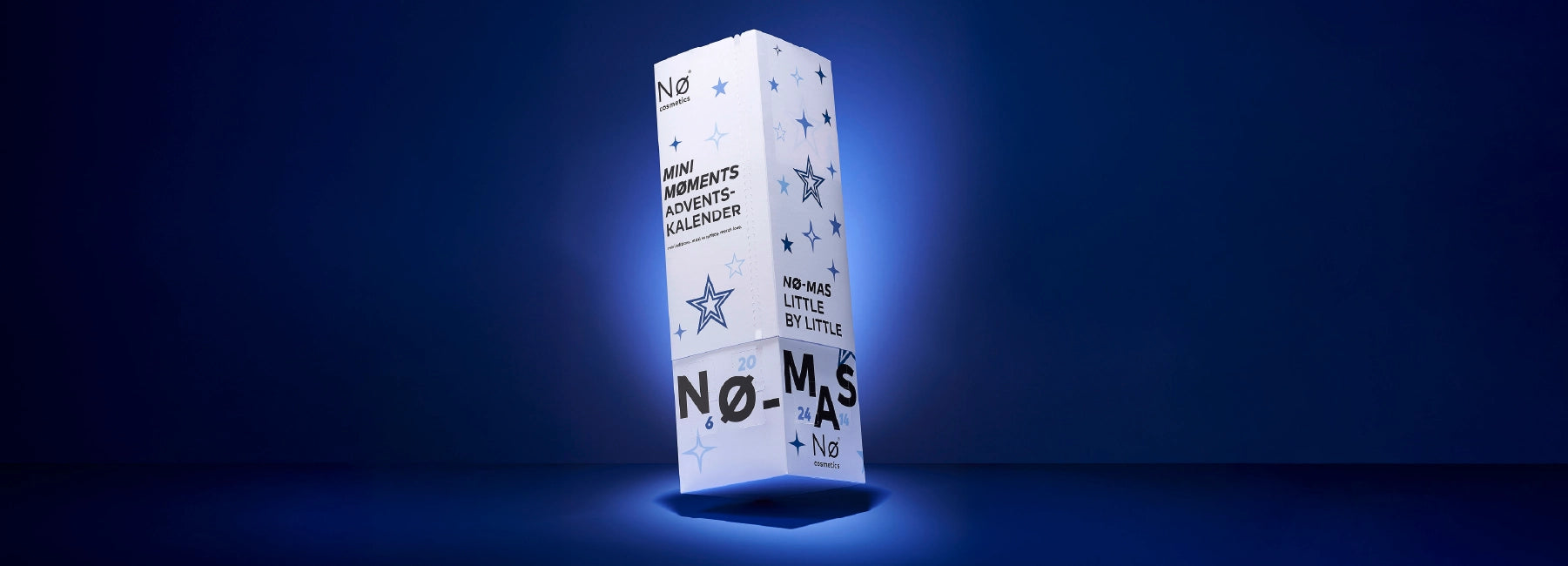 Nø Cosmetics Mini Moments Adventskalender auf blauem Hintergrund, Banner Desktop.